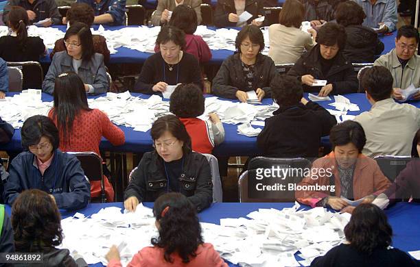 Tellers count votes cast in the general election in Seoul, South Korea, on Wednesday, April 9, 2008. President Lee Myung Bak's Grand National Party...