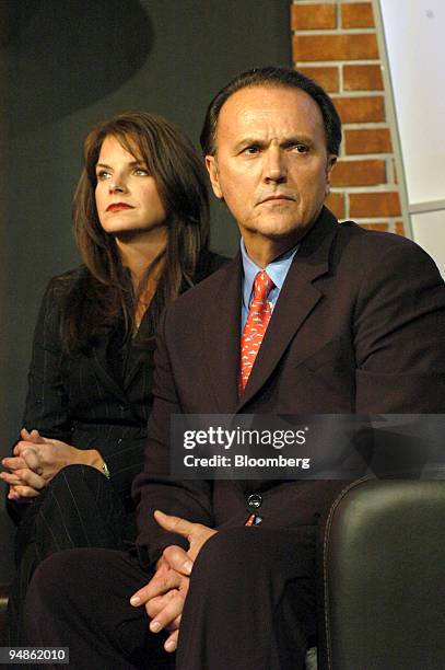 Richard Scrushy, right, former Healthsouth CEO, sits with his wife, Leslie, left, during a news conference in Birmingham, Alabama on October 27,...