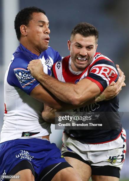 James Tedesco of the Roosters is tackled by Moses Mbye of the Bulldogs during the round seven NRL match between the Canterbury Bulldogs and the...