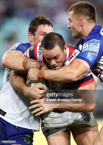 Boyd Cordner of the Roosters is tackled by the Bulldogs defence during the round seven NRL match between the Canterbury Bulldogs and the Sydney...