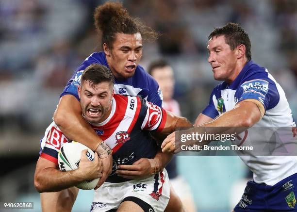 James Tedesco of the Roosters is tackled by the Bulldogs defence during the round seven NRL match between the Canterbury Bulldogs and the Sydney...