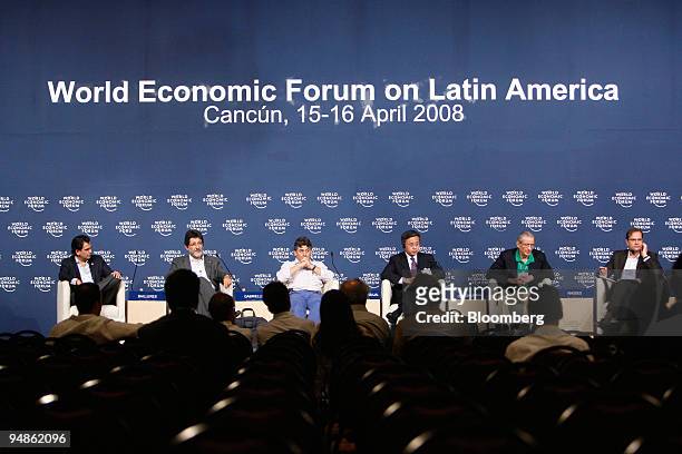 Attendants listen to William Rhodes, senior vice chairman of Citigroup Inc., second from right, during an opening news conference for the World...
