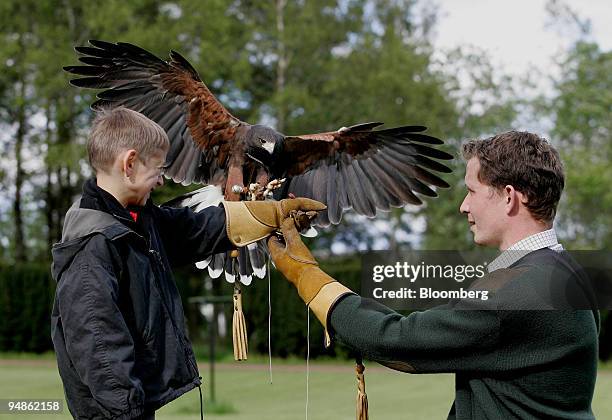 Milo Kremer with instructor Mike Coles at the falconry center at Gleneagles Hotel in Perthshire, Scotland, Sunday, May 29, 2005. With an extensive...