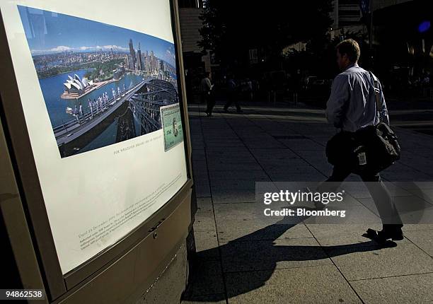 Commuter walks through Macquarie Place in Sydney, Australia Thursday, December 16, 2004. Australia's dollar rose to a one-week high after a report...