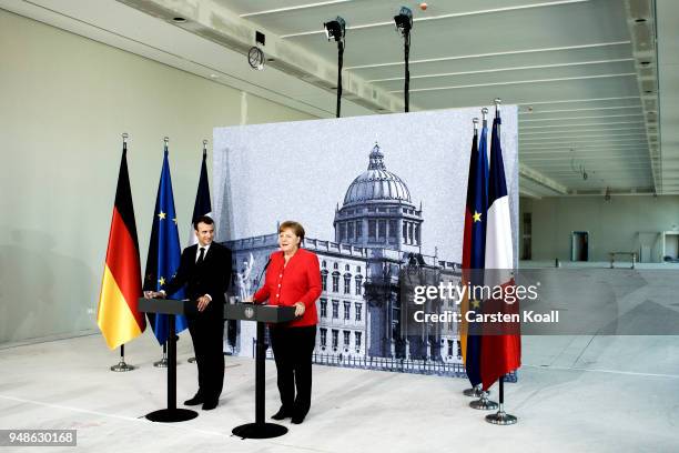 German Chancellor Angela Merkel and French President Emmanuel Macron attend a pressconference following a visit in the Humboldt Forum construction...