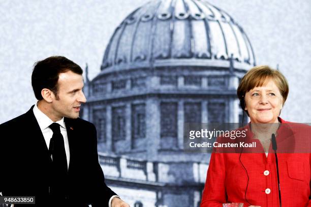 German Chancellor Angela Merkel and French President Emmanuel Macron attend a pressconference following a visit in the Humboldt Forum construction...