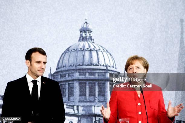 German Chancellor Angela Merkel and French President Emmanuel Macron attend a pressconference following a visit in the Humboldt Forum construction...