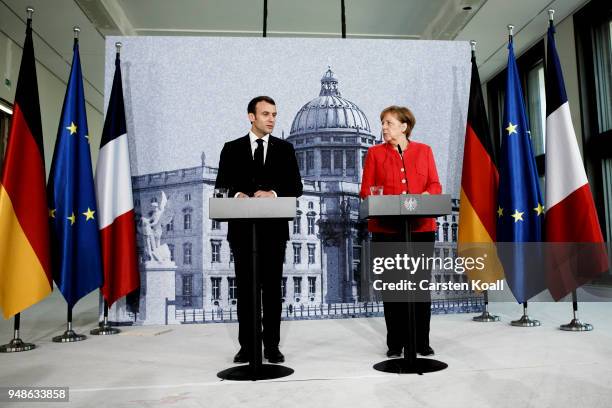 German Chancellor Angela Merkel and French President Emmanuel Macron attend a pressconference following a visit in the Humboldt Forum construction...