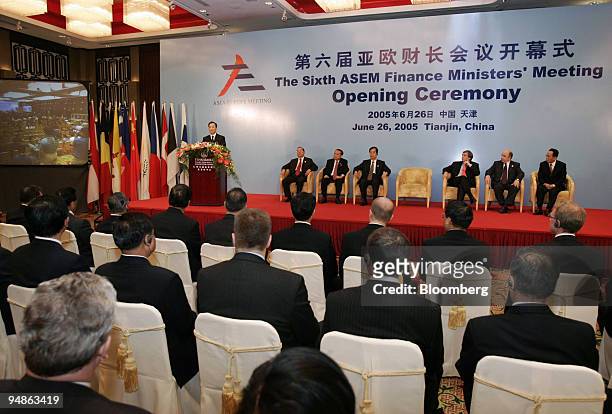 Chinese Premier Wen Jiabao, standing left, delivers the opening address at a meeting of European and Asian finance ministers in Taida, China Sunday,...