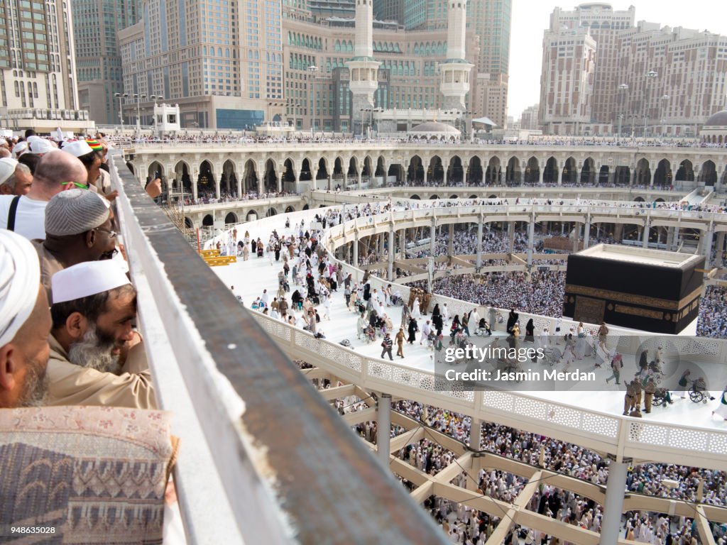 Muslim people praying in Kaaba