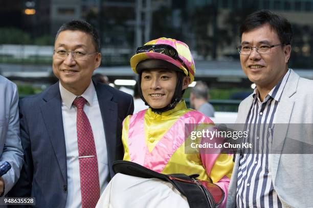 Jockey Keith Yeung Ming-lun, trainer Francis Lui Kin-wai and owner celebrate after Art Of Raw winning the Race 3 Kowloon Tsai Handicap at Happy...