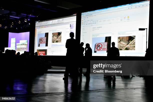 Large screens display web-based versions of Microsoft Office word processing and spreadsheet programs during the Microsoft Professional Developers...