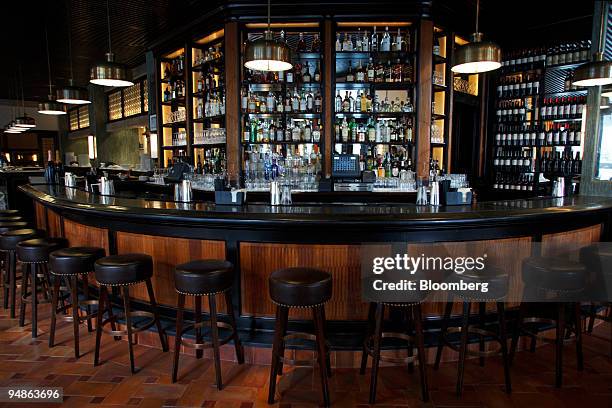 Stools line the bar at Ago, a restaurant located at 377 Greenwich Street in New York, U.S., on Monday, April 7, 2008. Actor Robert DeNiro, who...