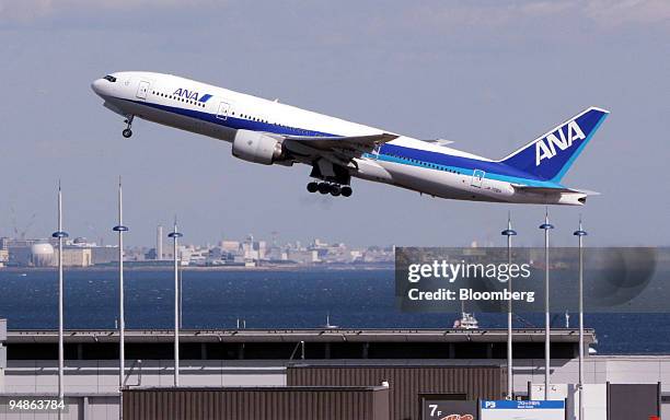 An All Nippon Airways passenger jet takes off from Haneda Airport in Tokyo, Saturday, February 4, 2006. Japan Airlines Corp.'s third-quarter loss...
