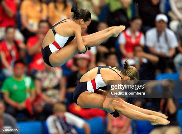 Mary Beth Dunnichay, right, and Haley Ishimatsu both of the U.S., hold a pike in the women's 10-meter synchronized diving event during day four of...