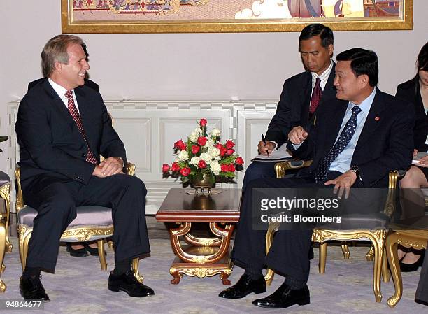 Charles Williamson, left, chief executive of Unocal Corp meets Thai Prime Minister Thaksin Shinawatra, right, at Government House in Bangkok,...