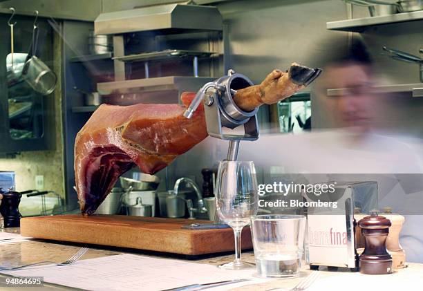 Jamon serrano sits on the bar in Barrafina restaurant in Soho, London, U.K., on Thursday, Feb. 25, 2008. The line starts at the far end of the room...