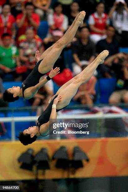 Choe Kum Hui, left, and Kim Un Hyang of North Korea, hodl their positons in the women's 10-meter synchronized diving event during day four of the...