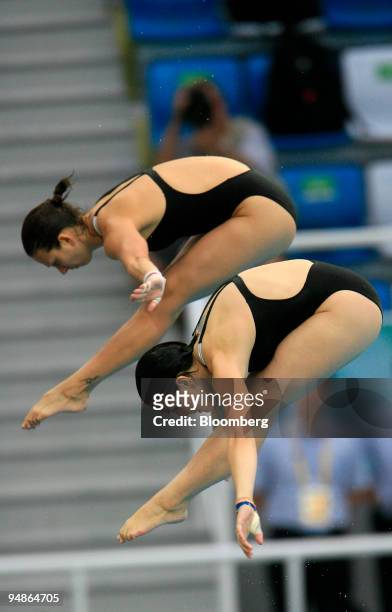 Stefanie Anthes, left, and Nora Subschinski of Germany, hold a pike position in the Women's 10-meter Synchronized Diving during day four of the 2008...