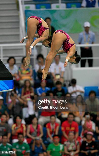 Paola Espinosa, left, and Tatiana Ortiz of Mexico, hold a pike position in the women's 10-meter synchronized diving event during day four of the 2008...