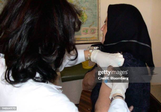 Romanian public health doctors and nurses provide bird flu vaccine to residents in the region of Tulcea, Romania, on Wednesday, October 12, 2005....