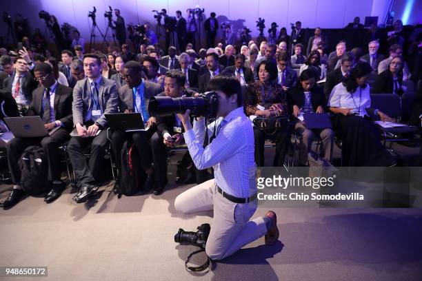 Journalists from around the world attend a news conference with International Monetary Fund Managing Director Christine Lagarde at IMF Headquarters...