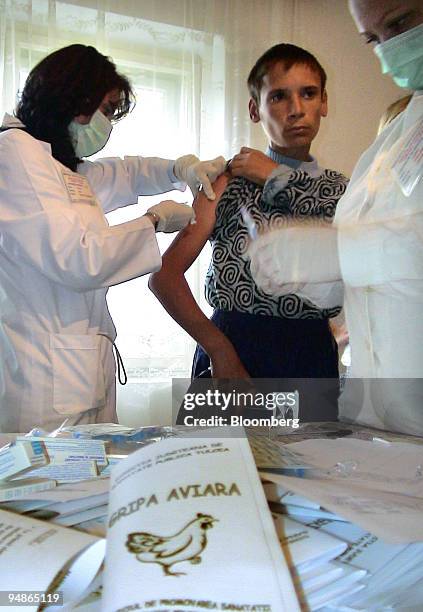 Romanian public health doctors and nurses provide bird flu vaccine to residents in the region of Tulcea, Romania, on Wednesday, October 12, 2005....