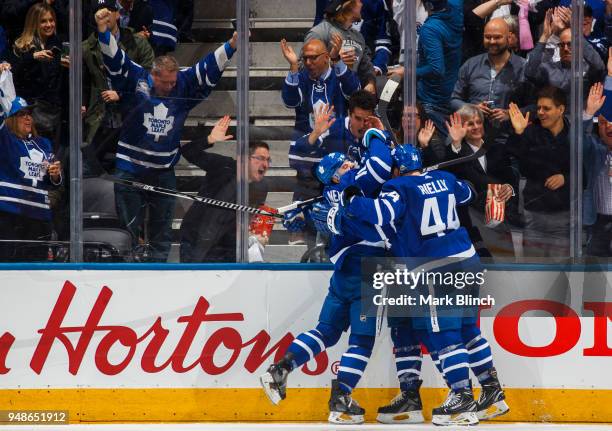 Patrick Marleau of the Toronto Maple Leafs celebrates his goal with teammates Mitchell Marner and Morgan Rielly against the Boston Bruins in Game...