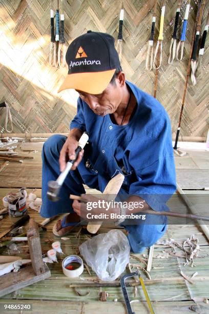 Craftsman repairs an elephant polo stick at the 2008 King's Cup Elephant Polo competition at the Anantara Golden Triangle resort in Chiang Rai,...