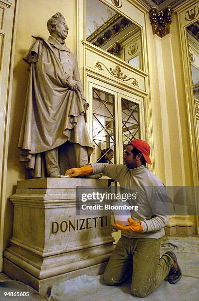 Workman puts the finishing touches to renovation work at La Scala opera house in Milan, Italy, Friday, November 19, 2004. La Scala reopens December 7...