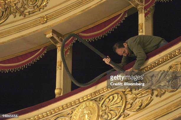 Workman puts the finishing touches to renovation work at La Scala opera house in Milan, Italy, Friday, November 19, 2004. La Scala reopens December 7...