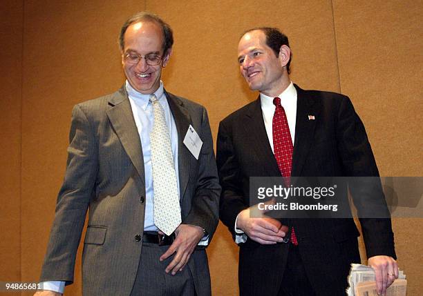 New York State Attorney General Eliot Spitzer, right, shares a laugh with Kroll Inc. CEO Michael Cherkasky after Spitzer spoke at a seminar on mutual...