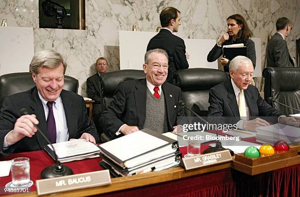 Senators Max Baucus, left-right, Chairman Charles Grassley and Orrin Hatch chat before the start of a hearing of the Senate Finance Committee,...