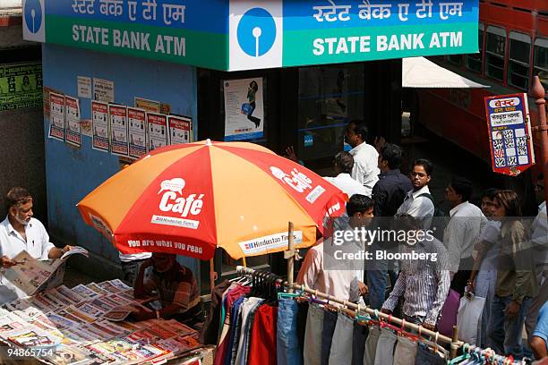 People line up outside a State Bank of India automated teller machine  News Photo - Getty Images