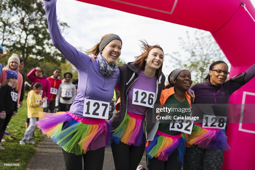 Cheering For Running Racers Enthusiastic Female Runners In Tutus Cheering Crossing Finish Line At ...