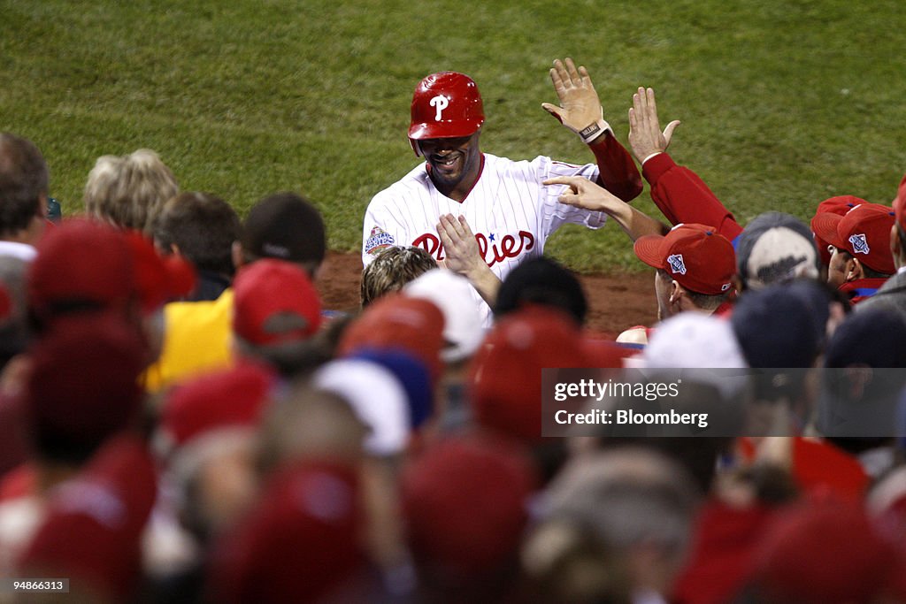 Jimmy Rollins of the Philadelphia Phillies smiles after scor