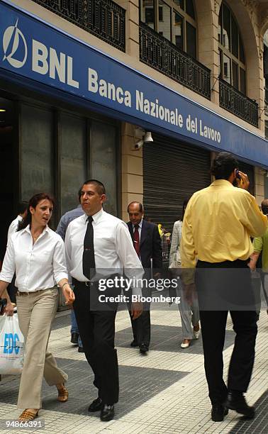 People walk in front of the headquarters of Banca Nazionale del Lavoro in Buenos Aires, Argentina, March 18, 2004 Banca Nazionale del Lavoro SoA,...