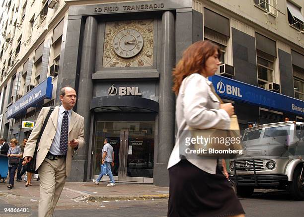People pass by the headquarters of Banca Nazionale del Lavoro in Buenos Aires, Argentina, March 18, 2004. Banca Nazionale del Lavoro SoA, Italy's...