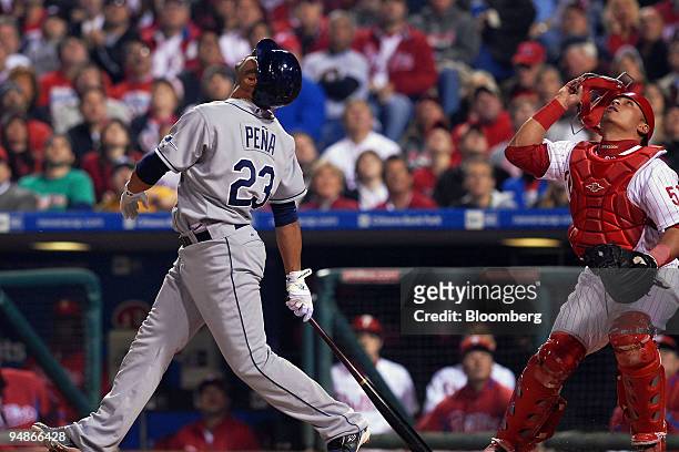 Carlos Pena of the Tampa Bay Rays pops out to catcher Carlos Ruiz of the Philadelphia Phillies in the first inning of game four of the Major League...