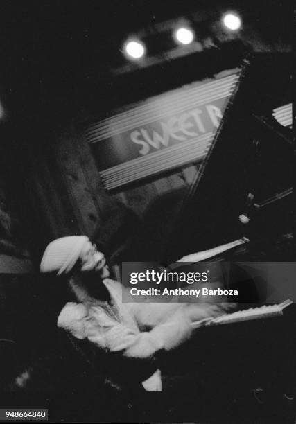 American Jazz musician Cecil Taylor plays piano as he performs onstage at the Sweet Basil nightclub, New York, New York, 1989.