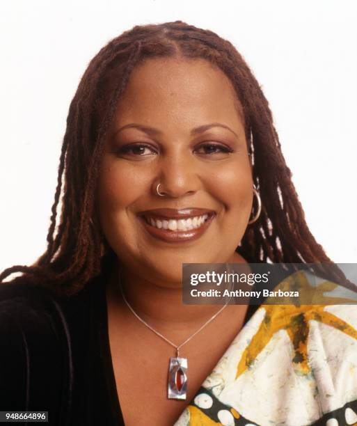 Portrait of American poet Samiya Bashir as she poses against a white background, New York, New York, 2000.