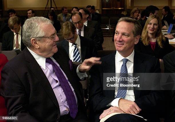 Robert Bennett, a partner with the law firm Skadden, Arps, Slate, Meagher & Flom LLP, left, chats with Alan Schwartz, president and chief executive...