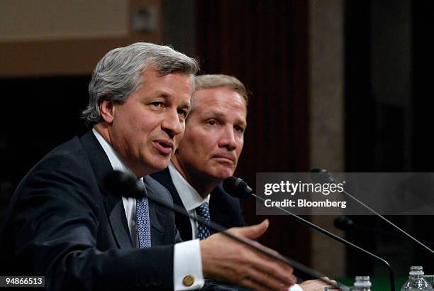 Alan Schwartz, president and chief executive officer of Bear Stearns Cos., right, listens to Jamie Dimon, chief executive officer of JPMorgan Chase &...