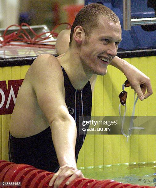 Czech's Svoboda Kvetoslav smiles after winning the men's 200m freestyle final race at the FINA Swimming World Cup 2002/2003 short-course in Shanghai,...