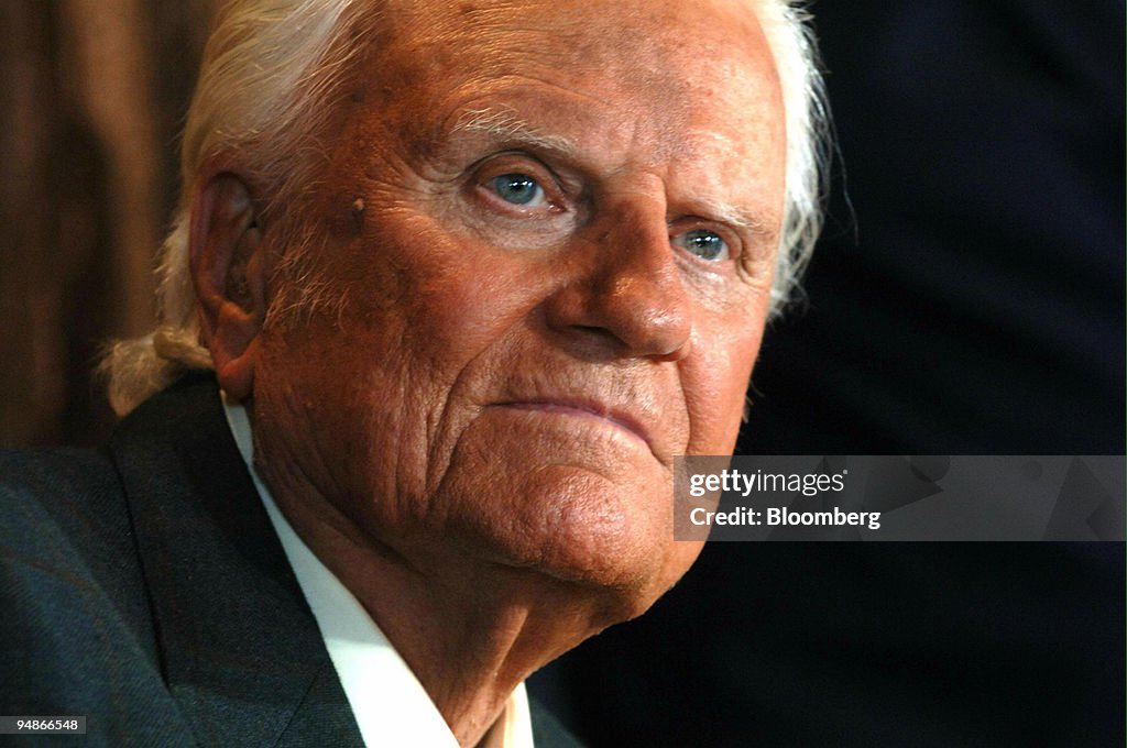 Billy Graham participates in a press conference in New York,