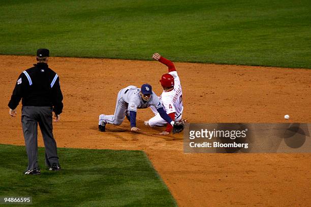 Eric Bruntlett of the Philadelphia Phillies, right, is safe at second and advanced to third after an errant throw by Dioner Navarro of the Tampa Bay...