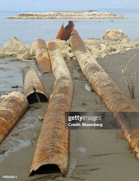 The abandoned, rusting remains of a tailings pipeline left over from the Marcopper Mining Corp. Operation lie on Calancan Beach October 11, 2005 on...