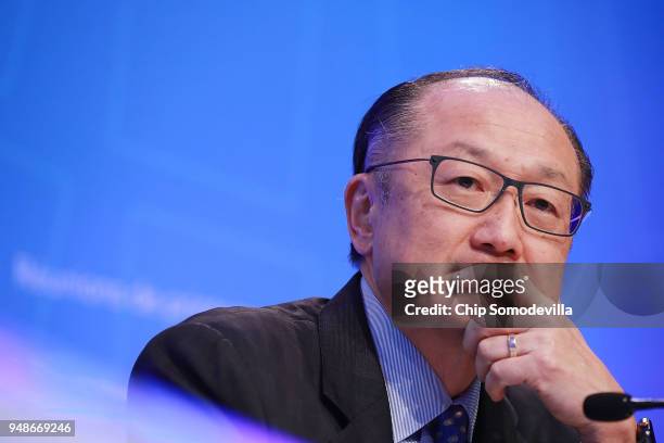 World Bank President Jim Yong Kim listens to reporters' questions during a news conference at IMF Headquarters April 19, 2018 in Washington, DC. The...
