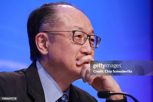 World Bank President Jim Yong Kim listens to reporters' questions during a news conference at IMF Headquarters April 19, 2018 in Washington, DC. The...