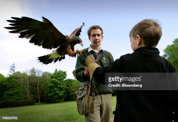 Milo Kremer with instructor Mike Coles at the falconry center at Gleneagles Hotel in Perthshire, Scotland, Sunday, May 29, 2005. With an extensive...